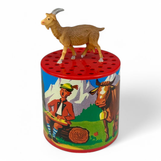 Voz de cabra con figura decorativa ·