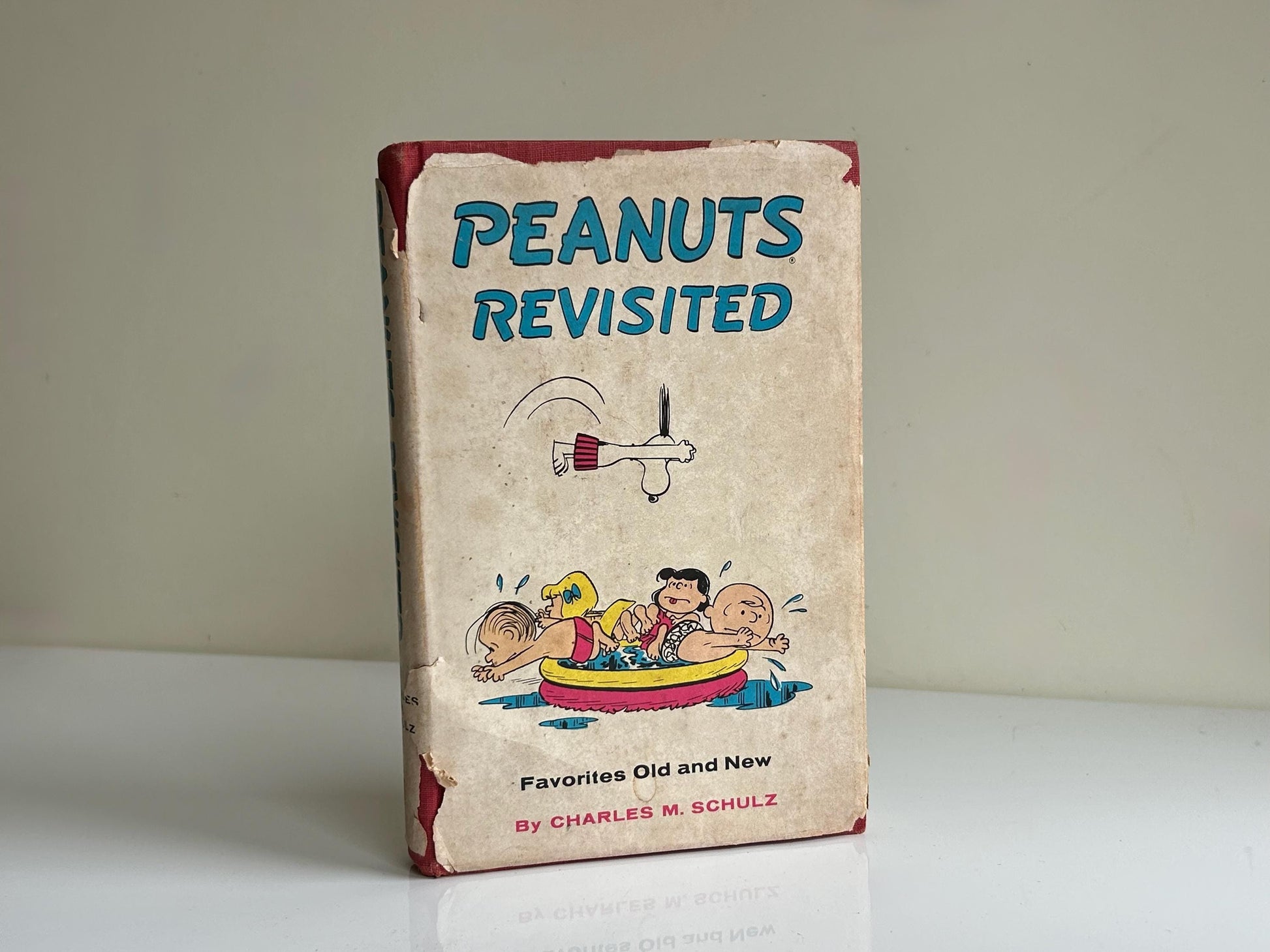 Libro vintage “Peanuts Revisited” (1959) – Charles M. Schulz, Snoopy y Charlie Brown, edición original con sobrecubierta