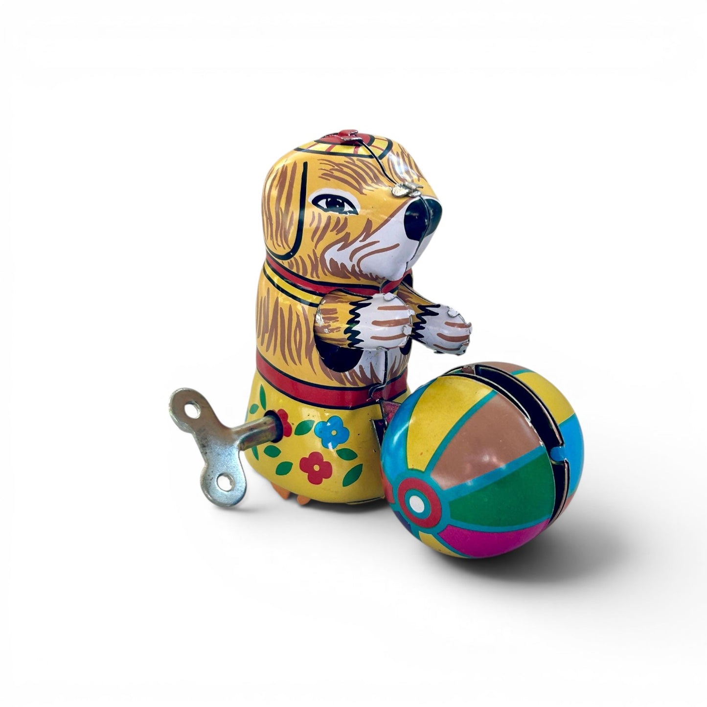 Perrito con pelota, juguete vintage de hojalata autómata a cuerda.