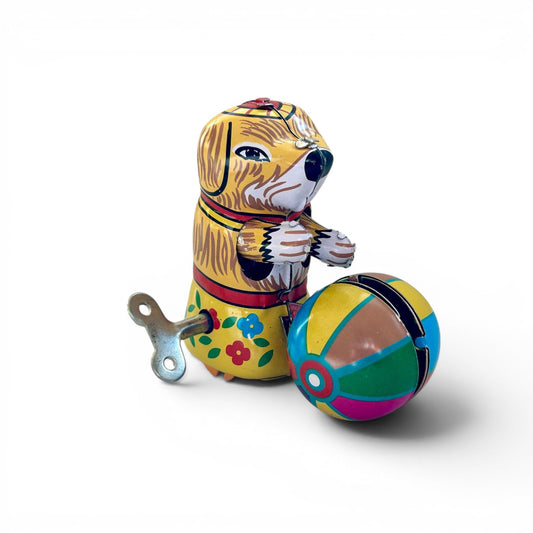 Perrito con pelota, juguete vintage de hojalata autómata a cuerda.