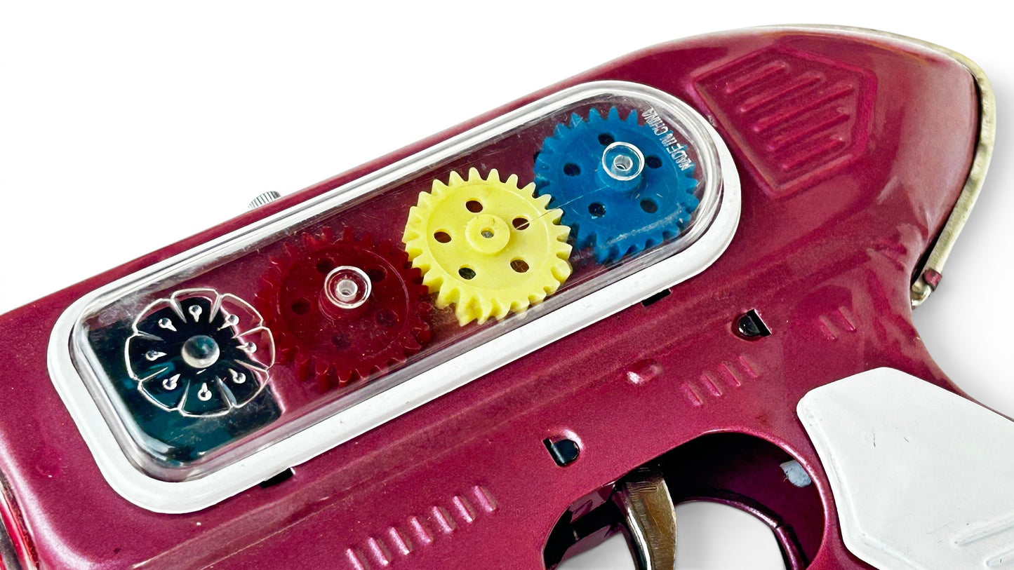 Pistola espacial hojalata · Fricción años 70s