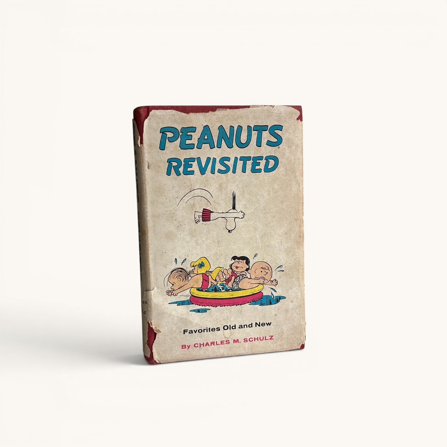 Libro vintage “Peanuts Revisited” (1959) – Charles M. Schulz, Snoopy y Charlie Brown, edición original con sobrecubierta