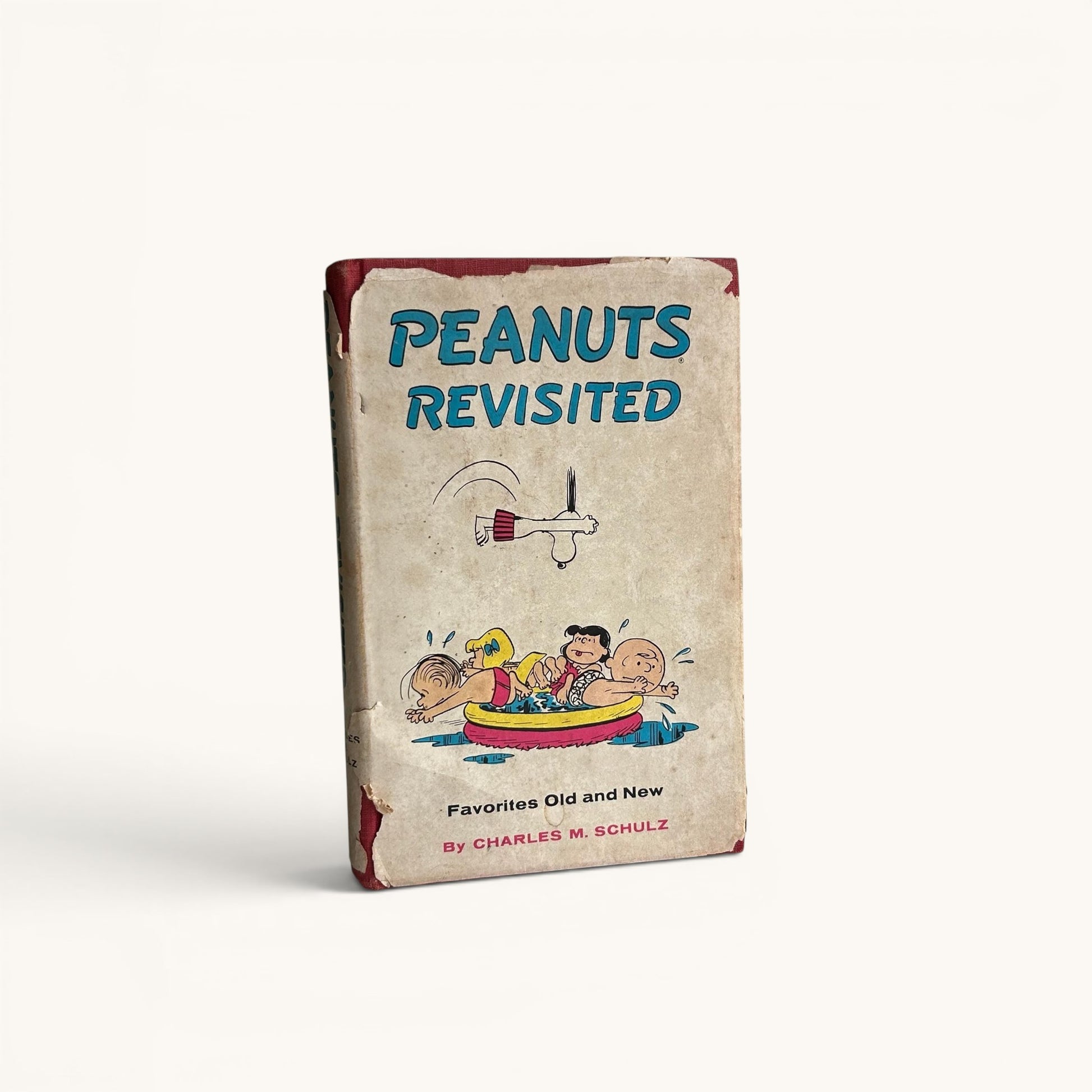 Libro vintage “Peanuts Revisited” (1959) – Charles M. Schulz, Snoopy y Charlie Brown, edición original con sobrecubierta